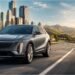 Cadillac Lyriq driving on highway in Tour mode for maximum electric range performance