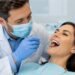Dentist checking a patient's teeth during a routine health and dentistry checkup appointment