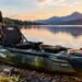 Angler standing on Pelican Catch Mode 110 kayak deck casting a fishing rod on calm open water.