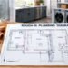 Licensed plumber reviewing a rough-in plumbing diagram before pipe installation during a renovation.